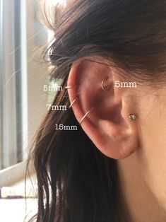 a woman's ear is shown with measurements