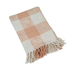 an orange and white checkered blanket with fringes