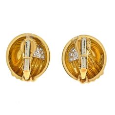 These stunning and bold David Webb Diamond Dome Round Clip On Earrings are made in 18k yellow gold and platinum. Accented with round cut diamond as accented. Finished with signature David Webb hammered finish, fastens with a heavy clip. Center Diamond Weight: 0.00Measurements: 22mm wideMetal Type: Platinum & 18K Yellow GoldMetal Weight: 33.5 gr.Signed: WEBBCondition: Excellent.Stock: RR8463 Designer Gold Diamond Earrings, Formal Designer Diamond Earrings In Yellow Gold, Designer Yellow Gold Diamond Earrings, Designer Yellow Gold Diamond Earrings For Formal Occasions, Formal Designer Yellow Gold Diamond Earrings, Designer Yellow Gold Clip-on Earrings For Anniversary, Designer Gold Diamond Earrings For Anniversary, Designer Diamond Earrings In Yellow Gold, David Webb