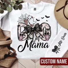 Personalized Boo- Jee Mama SweatShirt On Sleeve, Custom Mama Sweater, Halloween Mama Shirt, Spooky Season, Retro Halloween Hoodie The Standard T-Shirt, personalized to suit your individual style, serves as the perfect medium for self-expression. Made from 100% preshrunk cotton, this timeless short-sleeve tee not only ensures comfort but also offers ample opportunities for print-on-demand customization. Whether you seek to showcase your creativity, promote your brand, or commemorate a special occ White Halloween Shirt With Custom Print, White Halloween Shirt With Sublimation Print, Spooky Mama Shirt, White Halloween T-shirt With Custom Print, Spooky Crew Neck T-shirt With Sublimation Print, Mama Sweater, Halloween Hoodie, Sublime Shirt, Mama Sweatshirt