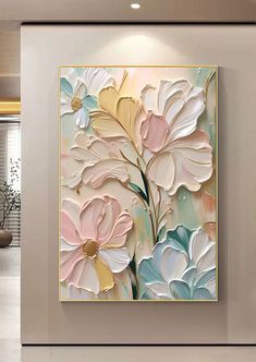 a painting on the wall in a room with white walls and flooring is decorated with flowers