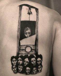 a man's back with an image of a cell phone and skulls on it