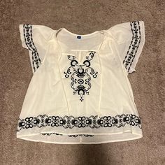 Old Navy Embroidered Top. Off-White With Black Embroidery. Size Medium Summer Tops With Contrast Embroidery, Casual White Embroidered Top, White Top With Geometric Embroidery For Vacation, Casual White Tops With Geometric Embroidery, Casual White Blouse With Embroidered Hem, White Bohemian Top With Geometric Embroidery For Vacation, White Casual Top With Floral Embroidery, White Casual Tops With Geometric Embroidery, Casual White Blouse With Geometric Embroidery