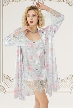 Embrace elegance with our stunning floral satin nightgown and robe set, adorned with delicate lace details. Perfect for special nights and celebrations, this set features: Floral Satin Fabric:  Luxurious satin with a beautiful floral pattern, offering a soft and silky touch. Lace Detailing:  Intricate lace accents on both the nightgown and the robe add a romantic and sophisticated touch. Comfortable Fit:  The nightgown is designed for a relaxed fit, ensuring comfort and style. Chic and Versatile Lace Sleepwear With Floral Print For Loungewear, Floral Lace Sleepwear, Lace Sleepwear With Floral Print, Feminine Satin Sleepwear Sets, Satin Sets With Lace Trim For Wedding Night, Satin Lace Trim Sets For Wedding Night, Feminine Floral Print Sleepwear For Wedding Night, Spring Satin Nightgown For Wedding Night, Spring Wedding Night Satin Nightgown