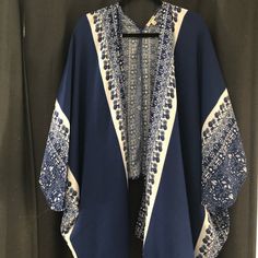 Kimono Cardigan - Blue And White - Long Front (Knee Length) Shorter Back. Small But Very Loose So It Fits Larger Sizes. No Tags But Never Worn. Blue Bohemian V-neck Outerwear, Blue V-neck Cardigan For Vacation, Casual Blue Cotton Kimono, Bohemian Blue V-neck Outerwear, White Casual Cardigan With Kimono Sleeves, Casual White Cardigan With Kimono Sleeves, Casual Blue Long Sleeve Kimono, Blue Open Front Summer Cardigan, Blue Bohemian Cardigan For Day Out