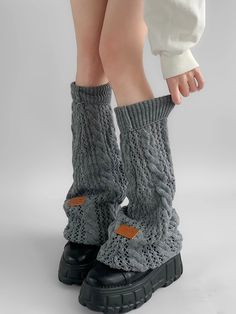 Elevate your winter wardrobe with our Gray/Black/Milk White Knit Flared Leg Warmers. Crafted from high-quality, soft knit fabric, these leg warmers are designed to provide both warmth and style. The flared design adds a touch of elegance and a retro flair, making them a perfect accessory for any outfit. Available in versatile colors of gray, black, and milk white, these leg warmers can easily be paired with skirts, dresses, or even over jeans for a chic layered look. Garment Size SizeFree SizeFu Cotton Knee-high Leg Warmers For Fall, Trendy Black Cotton Leg Warmers, Winter Cotton Fitted Sweater, Snug Cotton Sweater For Winter, One Size Winter Knit Sweater, One Size Knit Sweater For Winter, Black Cotton Casual Leg Warmers, Fitted Gray Winter Sweater, Trendy Black Leg Warmers For Fall