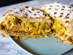 a sandwich cut in half on a blue plate