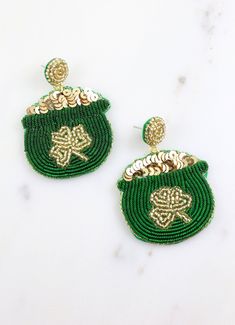 This classic pot of gold earring is embellished with beading and sequins with a gold shamrock accent. It is overflowing with gold sequins and on a post back. A must have accessory for Saint Patrick's Day! Dimensions: 2.5" long by 1.75" wide Gold Embellished Beaded Earrings For Party, Gold Embellished Earrings Gift, Saint Patrick's Day, Pot Of Gold, Gold Sequins, Gold Earring, St Patrick, St Patricks Day, Gold Earrings