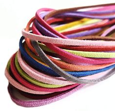 a bunch of different colored hair ties on top of each other