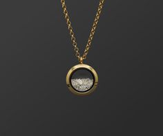 "This unisex customizable cremation ash locket is new to our collection of fill-at-home cremation pieces. Your purchase includes the gold toned locket, gold toned chain, and opal color of your choice and does not require mailing the ashes. It is composed of sturdy glass and gold-toned stainless steel (hypoallergenic, scratch/tarnish resistant). The chain is 32\". If screwed properly, the locket is air and watertight. The round pendant measures 25mm across and is the perfect size for a classy and Necklace For Ashes, Diy Urns For Ashes, Ashes Necklace Cremation Jewelry, Gold Cremation Necklace, Necklace Ashes, Thumbprint Jewelry, Memorial Brass Pendant Necklace, Urn Necklaces For Ashes, Ash Pendant Cremation Jewelry