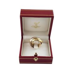 Cartier 18K Tricolor Gold Trinity Ring Size 4.5  This elegant triple band ring by Cartier is crafted in beautifully detailed 18K yellow, white and rose gold. Each band measures 3.9 mm.  Ring Size: 4.5  Weight: 6.79 dwt./10.56 gr.  Hallmark:  750 CARTIER 48 1997  Very good condition, professionally polished.  Will come packaged in a gift box or pouch (when possible) and will be shipped U.S. Priority Mail Insured. Cartier Triple Ring, Cartier Yellow Gold Rings Perfect For Gifts, Gold Jewelry For Anniversary With Original Box, Gold Jewelry For Anniversary In Original Box, Classic Jewelry With Original Box, Gold Wedding Jewelry With Original Box, Gold Trinity Ring, Triple Band Ring, Art Deco Sapphire Ring