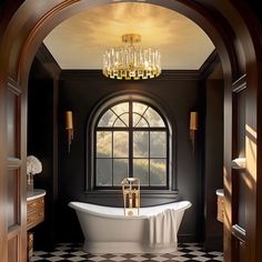 a bathroom with a claw foot tub and chandelier in the middle of it