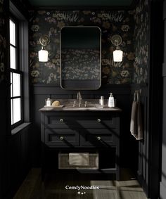 a black bathroom with floral wallpaper and dark wood flooring is featured in this image