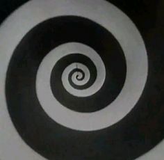 a black and white spiral design is seen in this image