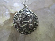 This is a Sterling Silver Pisces Medallion Pendant that we hand cast. Very detailed round solid medallion is about 3/4 inch round and hangs about 1 inch down with the loops. There is a shooting Star border design. Then the letter P in the back ground for Pisces. Then in the front is the two fish design. Amazing details are antiqued to bring out the high lights in the design. It is hanging on a Sterling Silver 18 inch Box style chain. For those born between~ Feb.19th-Mar.20th I will wrap the neck Nickel-free Sterling Silver Medallion Necklace, Spiritual Nickel-free Medallion Necklace With Round Pendant, Silver Symbolic Medallion Necklace, Nickel Free Sterling Silver Round Medallion Necklace, Nickel-free Sterling Silver Round Medallion Necklace, Symbolic Silver Round Disc Jewelry, Symbolic Medallion Necklaces Nickel Free, Symbolic Round Medallion Necklace As Gift, Symbolic Stamped Medallion Jewelry