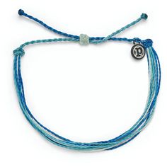 Wear this bracelet of ocean blues to feel the Pura Vida vibes. Each Good Vibes classic bracelet is handmade from waxed string cording, waterproof and totally unique. The more you wear it, the cooler it looks. The bracelet encourages the Pura Vida vibe, a philosophy to live life to the fullest. Pura Vida provides sustainable jobs to artisans worldwide who are dedicated to the "pura vida" way of life. | Pura Vida Original string bracelet in Deep Dive design. | Wax-coated polyester string cord with Puts Vida Bracelets, Blue Adjustable Bracelets For Everyday Wear, Blue Bohemian Friendship Bracelets For Everyday, Trendy Blue Braided Bracelets For Vacation, Everyday Adjustable Ocean-inspired Jewelry, Adjustable Ocean-inspired Jewelry For Everyday, Adjustable Ocean-inspired Everyday Jewelry, Trendy Blue Braided Bracelet With Sliding Knot, Blue Adjustable Braided Bracelets For Beach