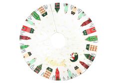 a white christmas tree skirt with houses and trees on it