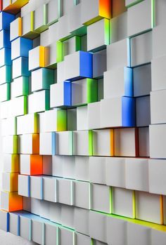 an abstract wall with multicolored squares on it