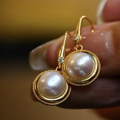 --- SPECIFICS --- 💚Materials: 100% Natural freshwater pearl with 24k gold plated s925 Sterling silver 💚-The pearl is 100% natural UNTREATED , UNHEATED, UNDYED Stone- 💚Metal: Real 24k Gold plated s925 Sterling Silver 💚Size: 24mm*10mm 💚Closure: the closure is made of 925 Sterling Silver.  💚Handmade Artwork, original design and copyright protected💚 💚💚Shipping We ship it in 5-7 days after the payment is made and you may choose your personalized shipping services. We shipping world wide and it is free international shipping. Please kindly be reminded that we are not responsible for any delay due to the local shipping service out of the US.  💚💚 Services 24/7 Rush order Free quality gift box 💚💚Cancelation and return  We accept 30 days return and cancelation  💚💚Small tips for wearin Exquisite Gold Pearl Earrings As Gift, Vintage Gold Pearl Earrings As Gift, Vintage Round Pearl Earrings For Gift, Gold Sterling Silver Pearl Earrings, Gold Sterling Silver Round Pearl Earrings, Nickel-free Yellow Gold Round Pearl Earrings, Nickel-free Yellow Gold Pearl Earrings, Yellow Gold Nickel-free Pearl Earrings, Elegant Gold Pearl Earrings Nickel-free