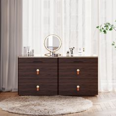 a dresser with two drawers and a round mirror on the top, in front of a window