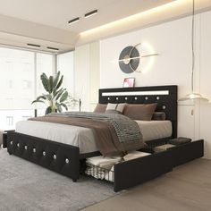 a bedroom with a large bed and white walls