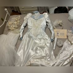 an assortment of wedding gowns and bridal items are on display in a box