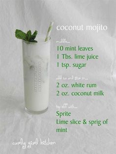 a tall glass filled with milk and mint