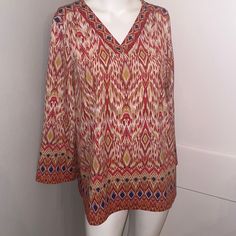 Beautiful Design Too With Stretch And V Neck Tunic And Sequin Design Perfect With Jeans Of Any Color. Can Be Worn Any Season ! Very Versatile! Red Tops With Vibrant Print For Fall, Red Tunic Tops For Fall, Red Blouse With Vibrant Print For Fall, Red Fall Tunic Top, V-neck Blouse With Vibrant Print, Casual Ikat Print Patterned Top, Vibrant Print V-neck Patterned Blouse, Festive Long Sleeve Ikat Print Tops, Vibrant Print V-neck Blouse