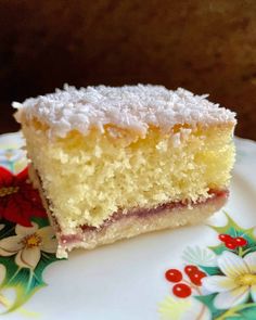 a piece of cake sitting on top of a flowered plate with a bite taken out of it