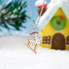 Our Santa Claus necklace is a great way to show your Christmas spirit and even if you don't catch a glimpse of Santa and his reindeer on Christmas eve you'll still have this amazing Christmas necklace to show how thankful you are for all the gifts he brings! Crafted in sterling silver and pave stones, this necklace showcases the Santa Claus  rises from the chimney for a Christmas surprise. Embrace the holiday spirit with this festive necklace and get ready to surprise someone with a fashionable Holiday Sterling Silver Necklace, Christmas Gift Sterling Silver Necklace, Sterling Silver Necklace For Christmas Gift, Sterling Silver Necklaces For Christmas, Christmas Sterling Silver Jewelry, Christmas Holiday Pendant Necklace, Christmas Holiday Pendant Necklaces, White Necklace For Christmas Holiday, Cool Christmas Gifts