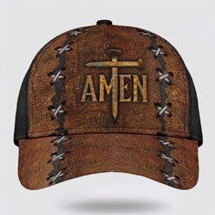 an old baseball cap with the word amen written on it and two crossed swords