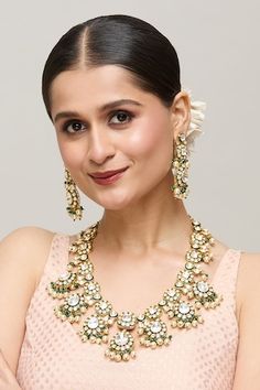 Gold plated drop pattern necklace studded with white polki, green beads and pearl tassels. Comes with matching earrings. - Aza Fashions Elegant Green Kundan Necklace With Latkans, Elegant White Kundan Necklace With Latkans, Elegant Green Bridal Necklace With Latkans, Pearl Tassels, Drops Patterns, Jewellery Sets, Green Beads, Buy Gold, Gold Brass