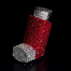 red and silver sequinized tube on black background