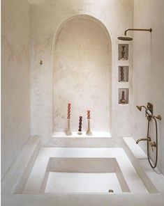 a bathroom with white walls and floor