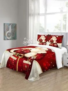 a bed room with a neatly made bed and christmas decorations on the comforter set