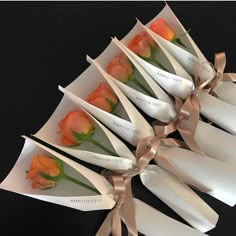 a bunch of flowers that are in some paper