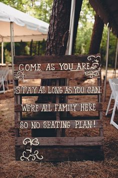 a wooden sign that says, come as you are stay as long as you can were all family here so no seating plan