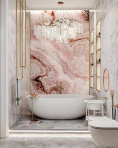 a bath room with a toilet and a bath tub next to a wall mounted chandelier