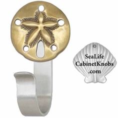 an image of a blue sand dollar on a metal hook with the sealife cabinet knobs com logo below it