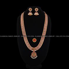 Original Design by Classical Dance Jewelry® ❥ Pearl Kempu White Stone Design Long Haram Chain is traditional and ethnic South Asian Indian Jewelry. ❥ Wide Padakkam Peacock Style Pendant Pearls Long Necklace. ❥ You Can wear this set for Bharatnatyam Kuchipudi Dance Performances, Engagement, Weddings, Birthdays, festivals, puja, Ammavaru Amman decorations, Durgamata Decoration ❥ Handmade Indian Traditional Item. Set has variations please CHECKOUT Variants ☛ Long Necklace with earrings ☛ Long Neckl Temple Jewelry Style Traditional Wear For Wedding And Diwali, Traditional Red Temple Necklace For Celebrations, Temple Jewelry Sets For Puja With Meenakari, Temple Jewelry Sets With Meenakari For Puja, Red Temple Jewelry Sets For Celebration, Temple Necklace With Chandbali Shape For Celebrations, Traditional Drape Jewelry For Navratri Ceremonial, Temple Jewelry Sets With Zari Work For Celebrations, Temple Jewelry Bridal Necklace With Zari Work For Puja