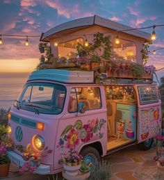 an old vw bus is decorated with flowers and potted plants on the roof