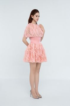 Expertly crafted from lightweight mesh material, this dress offers a unique combination of style and comfort. The elegant A-line silhouette flatters any figure, while the cape shoulder adds a touch of sophistication. The gather detailing adds texture and movement, making this mini dress a must-have for any wardrobe. Cape Sleeves, Mesh Material, Lace Pattern, Designer Collection, Pink Floral, Sleeve Styles, Latest Fashion Trends, Custom Color, Designer Dresses