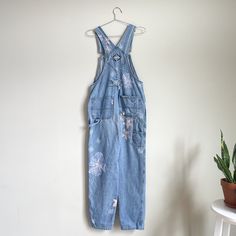 Vintage denim overalls with patches, hand painted flowers, and embroidery. Spring Light Wash Distressed Overalls, Hand Dyed Cotton Jeans For Spring, Spring Distressed Overalls, Embroidery Dresses, Upcycled Fashion, Floral Denim, Hand Painted Flowers, Painted Flowers, Denim Overalls