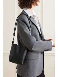 JIL SANDER Knotted leather shoulder bag | NET-A-PORTER Formal Crossbody Bucket Bag With Leather Handles, Designer Soft Leather Shoulder Bag For Work, Elegant Leather Bucket Bag For Work, Elegant Bucket Bag With Leather Handles For Work, Chic Leather-lined Bucket Bag For Business, Elegant Bucket Bag With Leather Lining For Work, Elegant Workwear Bucket Bag With Leather Lining, Elegant Bucket Bag For Work With Leather Lining, Chic Business Bucket Bag With Leather Lining