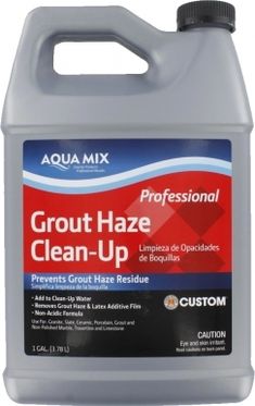 a gallon of liquid with the words grout haze clean - up on it's side