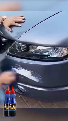 a car being waxed with an advertiser's hand next to it