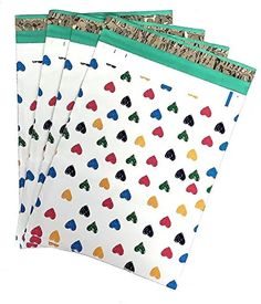 four envelopes with different colored hearts on them