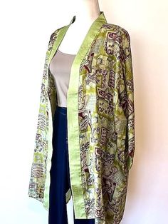 This short tie dye silk kimono jacket is the perfect accessory for the upcoming seasons.  The bold color is striking and the introduction of a muted engineered border print, regal.  This is a kimono jacket that  can move between dressy to casual. This is very unique and will move this top to the "most wanted" jacket for upcoming season.  Wear this over slacks and a camisole, jeans, shorts, or even a swimsuit. Looks great over yoga pants with a tank top. Don't forget that this can also be dressed Short Tie, Silk Kimono Jacket, Kimono Duster, Short Kimono, Most Wanted, Border Print, Silk Kimono, Silk Dyeing, Kimono Jacket