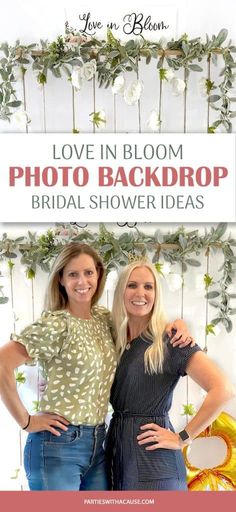 two women standing next to each other with the words love in bloom photo backdrop