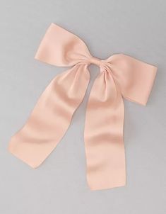 a pink bow on top of a white table